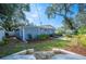 Newly painted home with a backyard and landscaping at 1632 Tangerine St, Lakeland, FL 33803
