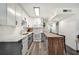 Modern kitchen with gray and white cabinets, butcher block counter, and white appliances at 1632 Tangerine St, Lakeland, FL 33803