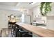 Modern kitchen with butcher block island, white cabinets, and stainless steel appliances at 1632 Tangerine St, Lakeland, FL 33803