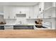 Modern kitchen with gray and white cabinets and a large butcher block island at 1632 Tangerine St, Lakeland, FL 33803