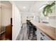 Long kitchen island with seating, gray cabinets, and open concept design at 1632 Tangerine St, Lakeland, FL 33803