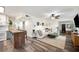 Open concept living and kitchen area with wood floors and modern design at 1632 Tangerine St, Lakeland, FL 33803