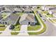 Aerial view of a house with an appealing landscaped yard and a private fenced backyard at 1878 Pristine Loop, Lakeland, FL 33811
