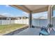 View of the backyard, patio, and white fence at 1878 Pristine Loop, Lakeland, FL 33811