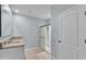Bathroom featuring double sinks, tile flooring, and updated shower at 1878 Pristine Loop, Lakeland, FL 33811