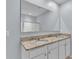 Bathroom featuring double sinks and a large mirror at 1878 Pristine Loop, Lakeland, FL 33811