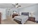 Primary bedroom with neutral walls, and an en-suite bathroom at 1878 Pristine Loop, Lakeland, FL 33811