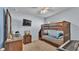 Bedroom with bunk beds, ceiling fan, desk, and carpet flooring at 1878 Pristine Loop, Lakeland, FL 33811