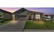 Charming single-Gathering home with a well-manicured lawn and an attached two-car garage at 1878 Pristine Loop, Lakeland, FL 33811