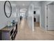 Inviting hallway features neutral colors and a view into the dining area at 1878 Pristine Loop, Lakeland, FL 33811