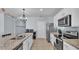 Spacious kitchen featuring stainless steel appliances and granite countertops at 1878 Pristine Loop, Lakeland, FL 33811