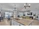Open-concept kitchen with views of the living and dining areas at 1878 Pristine Loop, Lakeland, FL 33811
