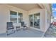 Covered patio includes outdoor seating and view of backyard at 1878 Pristine Loop, Lakeland, FL 33811