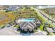 Aerial view of a community pool surrounded by lush landscaping and palm trees at 1878 Pristine Loop, Lakeland, FL 33811