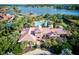 Aerial view of community pool and clubhouse near lake at 1958 Altavista Cir, Lakeland, FL 33810