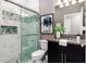 Modern bathroom with a glass shower and granite countertop at 1958 Altavista Cir, Lakeland, FL 33810