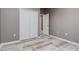 Cozy bedroom with wood-look floors and a double door closet at 1958 Altavista Cir, Lakeland, FL 33810