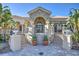 Elegant community clubhouse entrance with stone accents and landscaping at 1958 Altavista Cir, Lakeland, FL 33810