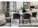 Bright dining area features a modern table with green chairs and marble floors at 1958 Altavista Cir, Lakeland, FL 33810