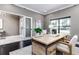 Bright home office features a large desk, comfortable seating, and natural light at 1958 Altavista Cir, Lakeland, FL 33810