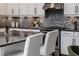 Modern kitchen with white cabinets and granite countertops at 1958 Altavista Cir, Lakeland, FL 33810