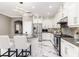 Modern kitchen with white cabinets, granite counters, and island at 1958 Altavista Cir, Lakeland, FL 33810