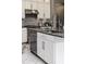 Modern kitchen with white cabinets, granite island, and stainless steel appliances at 1958 Altavista Cir, Lakeland, FL 33810