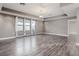 Spacious living room with wood-look floors and a chandelier at 1958 Altavista Cir, Lakeland, FL 33810