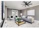 Bright living room with gray sofa and a modern coffee table at 1958 Altavista Cir, Lakeland, FL 33810