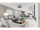 Spacious living area features a gray sofa, fireplace and marble floors at 1958 Altavista Cir, Lakeland, FL 33810