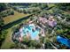 Resort-style pool with palm trees and clubhouse at 1958 Altavista Cir, Lakeland, FL 33810