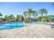 Community lap pool and leisure pool with palms at 1958 Altavista Cir, Lakeland, FL 33810
