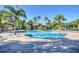Community lap pool and leisure pool with palms at 1958 Altavista Cir, Lakeland, FL 33810