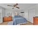 Bedroom with wood floors, ceiling fan, and dresser at 2055 S Floral Ave # 235, Bartow, FL 33830