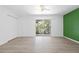 Bedroom with laminate flooring and private balcony access at 2348 Isle Royale Se Ct, Winter Haven, FL 33880