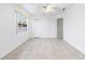 Simple bedroom with tile floors and ceiling fan at 2348 Isle Royale Se Ct, Winter Haven, FL 33880