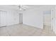 Bedroom with ensuite bathroom and tile floors at 2348 Isle Royale Se Ct, Winter Haven, FL 33880