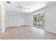 Bedroom with double closets and access to a balcony at 2348 Isle Royale Se Ct, Winter Haven, FL 33880