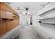 Garage with washer and dryer hookups and built-in shelving at 2348 Isle Royale Se Ct, Winter Haven, FL 33880