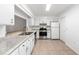 Kitchen with white cabinets, granite countertops, and stainless steel appliances at 2348 Isle Royale Se Ct, Winter Haven, FL 33880