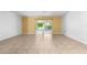 Living room with tile floors and view of a screened patio at 2348 Isle Royale Se Ct, Winter Haven, FL 33880