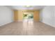 Bright living room with tile floors and sliding glass doors leading to a screened patio at 2348 Isle Royale Se Ct, Winter Haven, FL 33880