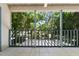 Screened balcony overlooking lush trees at 2348 Isle Royale Se Ct, Winter Haven, FL 33880