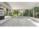 Serene screened patio offering a view of lush greenery at 2348 Isle Royale Se Ct, Winter Haven, FL 33880