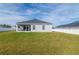 Spacious backyard with grassy lawn and privacy fence at 252 Walkers Point Dr, Auburndale, FL 33823