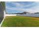 Backyard view of home with grassy lawn and fence at 252 Walkers Point Dr, Auburndale, FL 33823