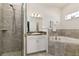 Bathroom with walk-in shower, soaking tub, and vanity at 252 Walkers Point Dr, Auburndale, FL 33823