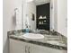 Modern bathroom with a white vanity and dark accent wall at 252 Walkers Point Dr, Auburndale, FL 33823