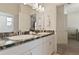 Double vanity bathroom with a view of another bedroom at 252 Walkers Point Dr, Auburndale, FL 33823