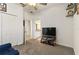 Bedroom with TV, couch, and en-suite bathroom access at 252 Walkers Point Dr, Auburndale, FL 33823
